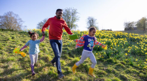 Family running through meadow